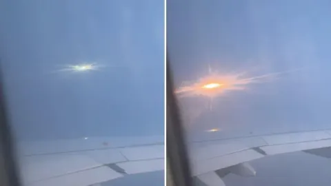 Svijetli meteor na nebu snimljen kroz prozor zrakoplova iznad oblaka.