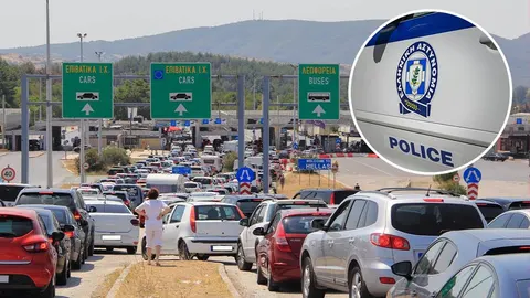 Duga kolona automobila na graničnom prijelazu uz putokaze za Grčku
