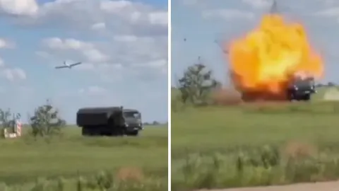 Bespilotna letjelica u letu i eksplozija vojnog kamiona na polju