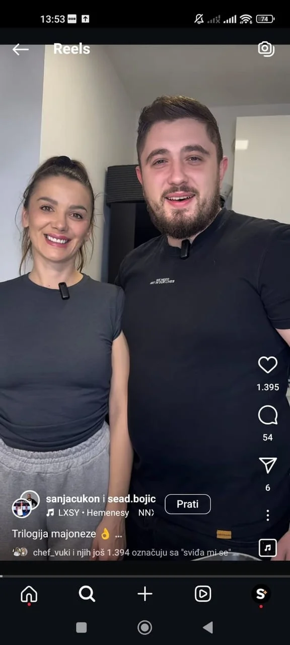 Snimka ekrana Reels videa s muškarcem i ženom u crnim majicama