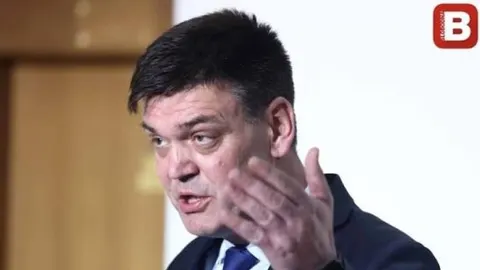 Portret Ilije Cvitanovića u tamnom odelu tokom govora